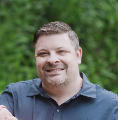 A headshot of a smiling Kelso